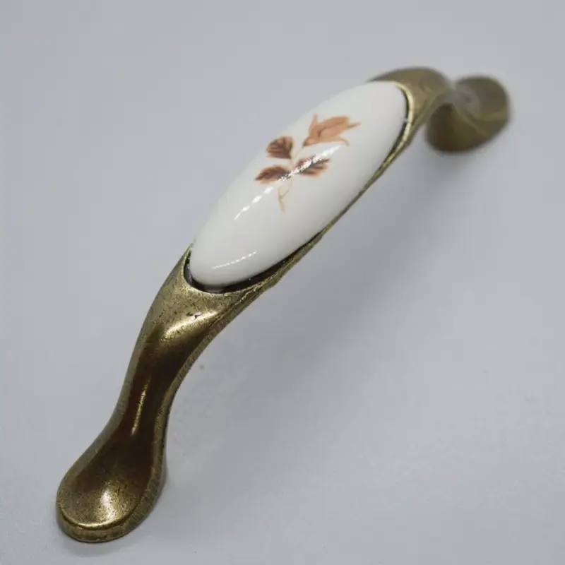 Porcelán-fém bútorfogantyú, bronz - barna virág motívummal, 96 mm furattávval Expressz szállítás